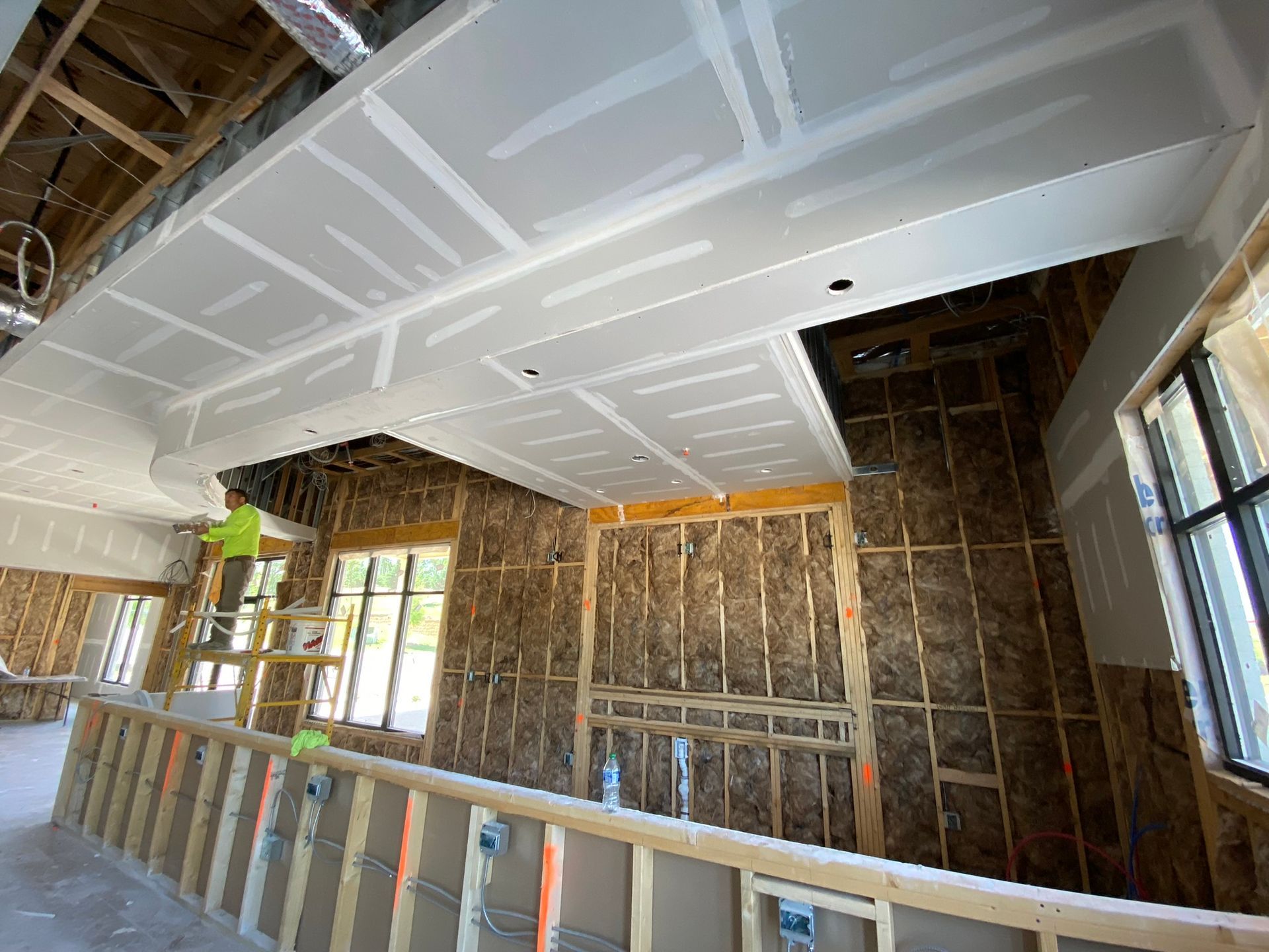 A room with a ceiling that is being built in a house.