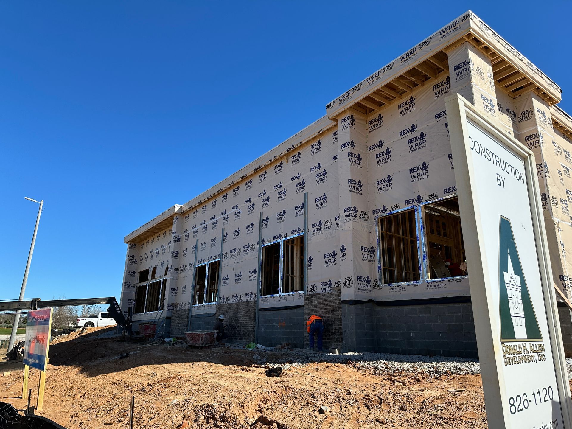 A building under construction with a sign that says a on it.