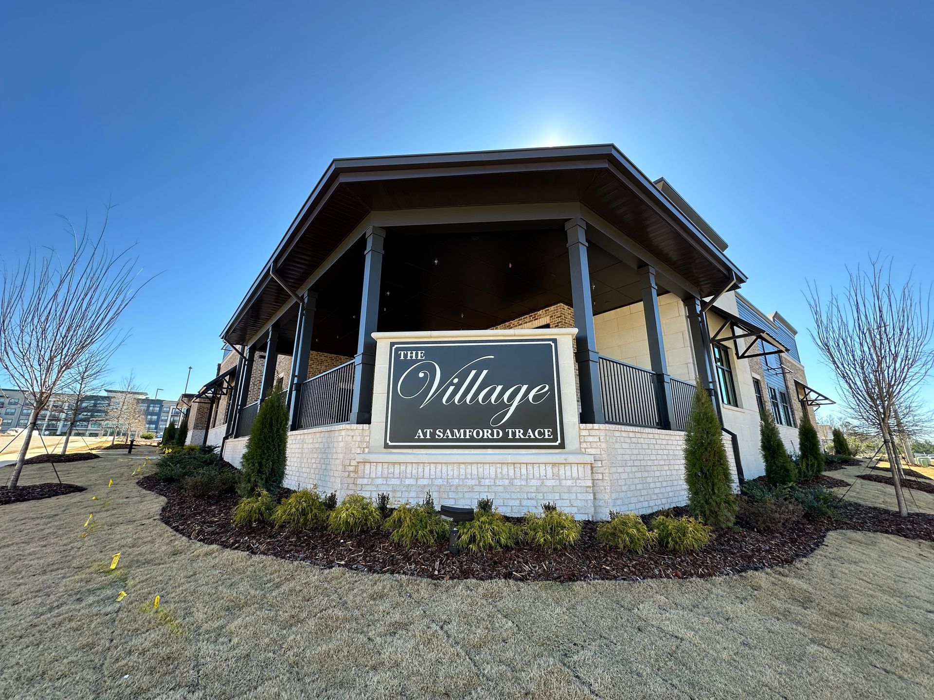 A large building with a sign that says village in front of it.