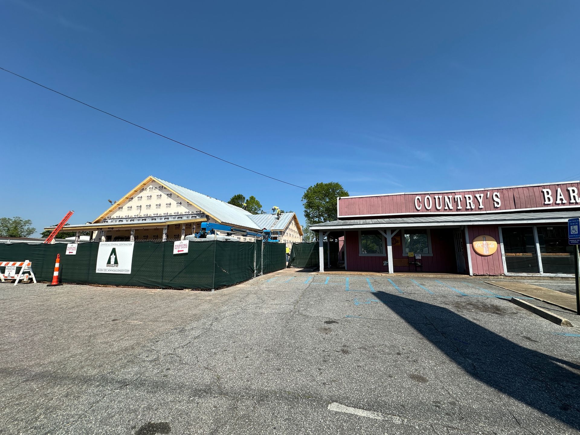 A building with a fence around it is being remodeled.