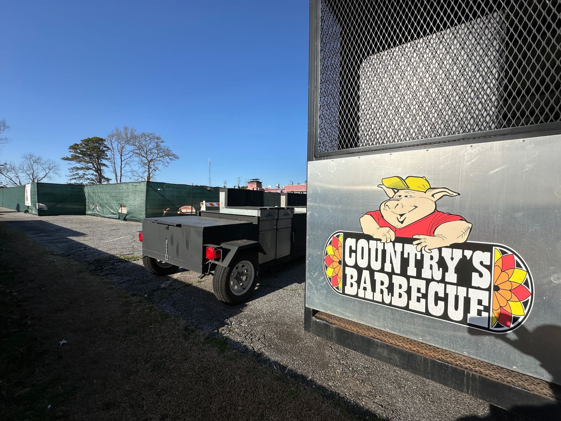 A sign for country 's barbecue with a pig on it
