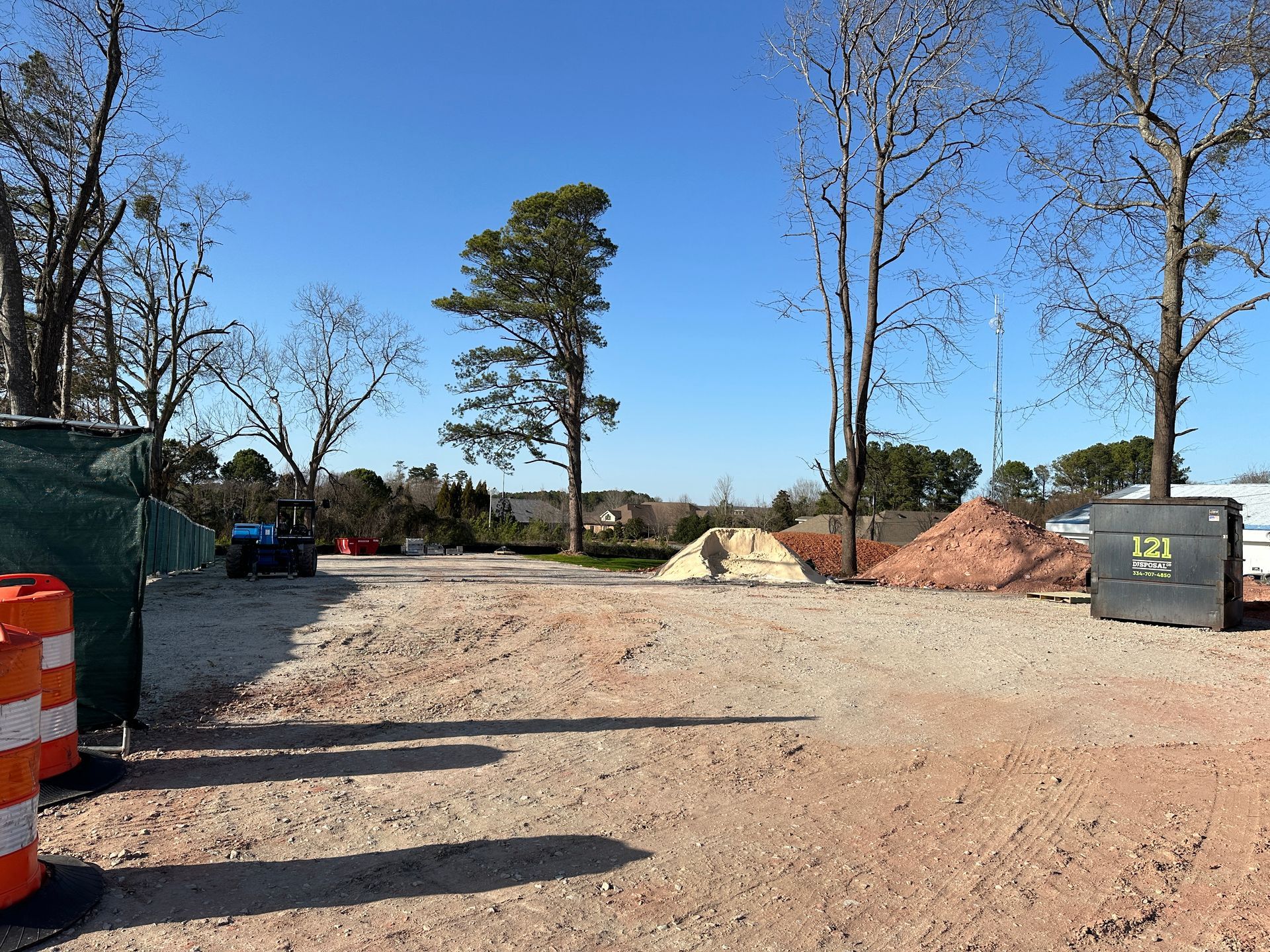 A construction site with a dumpster that says ' 753 ' on it