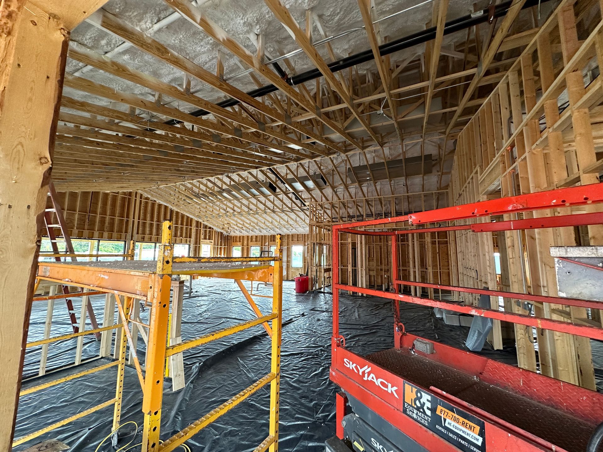 A construction site with a scaffolding and a crane.