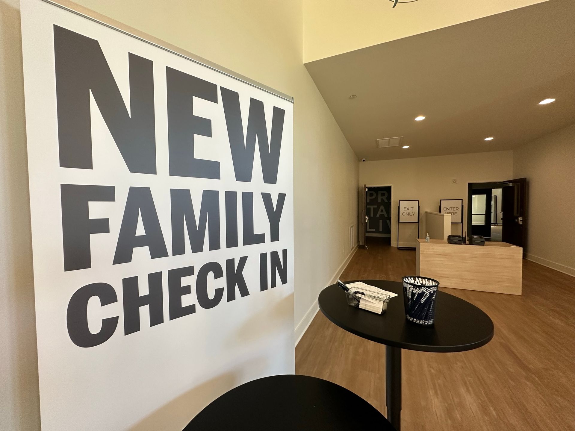 A room with a sign that says new family check in