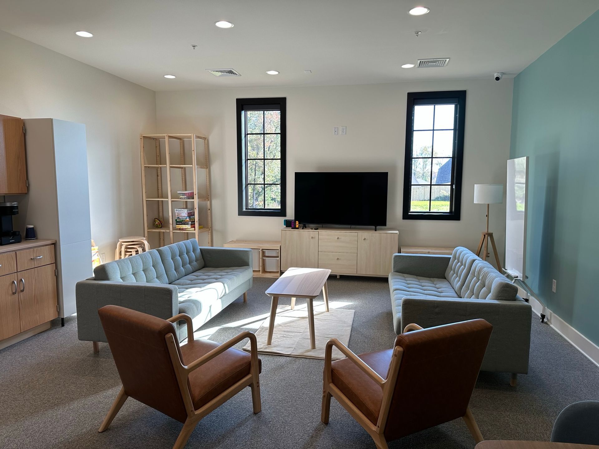 A living room filled with furniture and a flat screen tv.