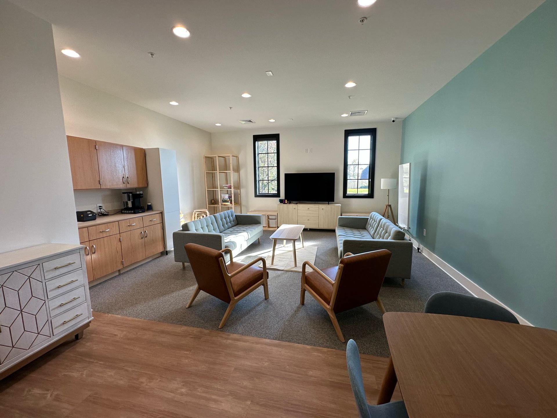 A living room filled with furniture and a flat screen tv.