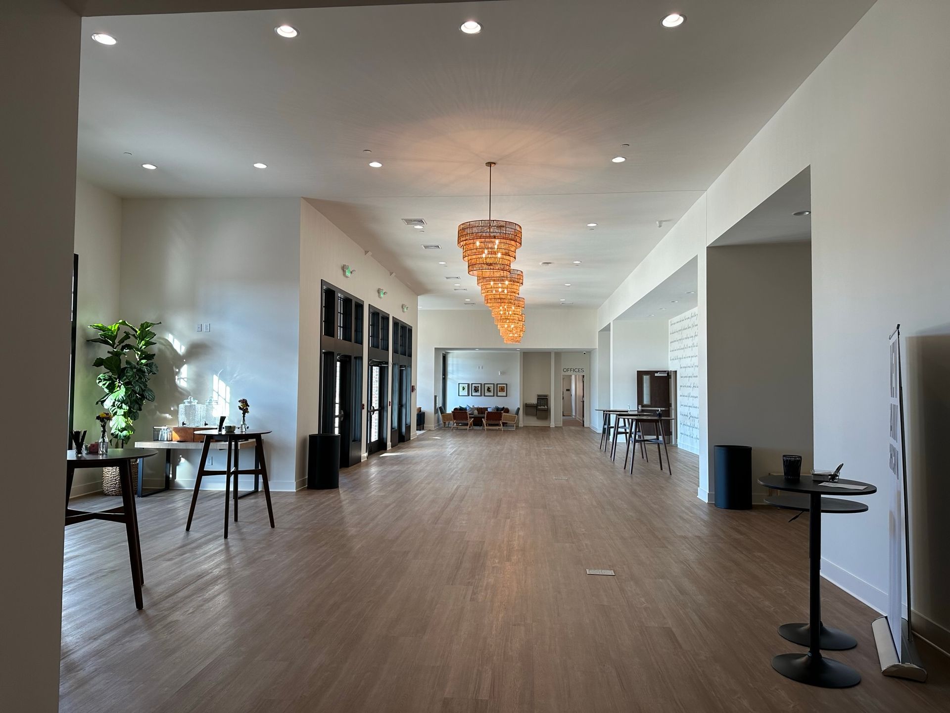 A large room with a chandelier hanging from the ceiling
