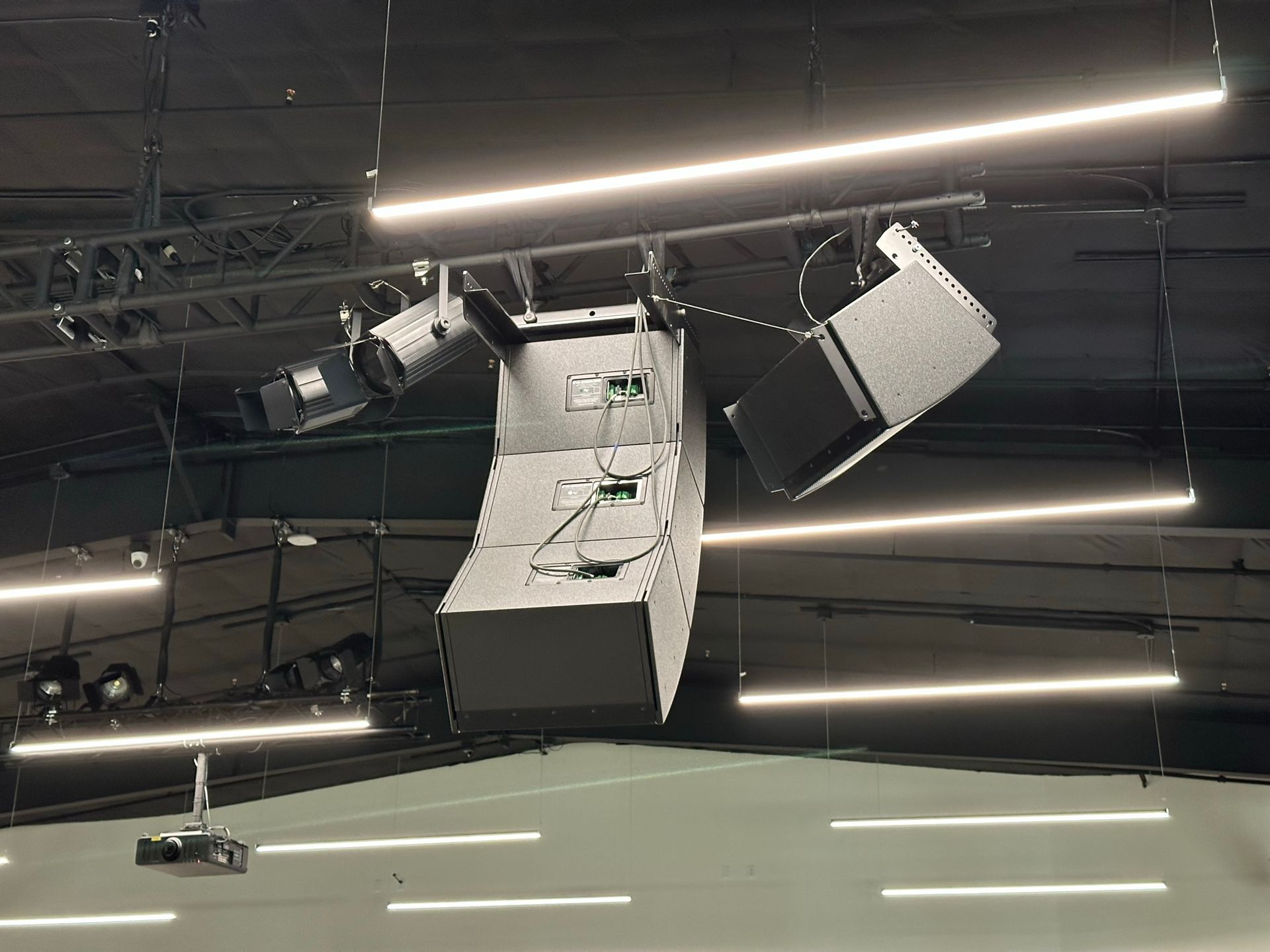 A ceiling with a lot of lights hanging from it