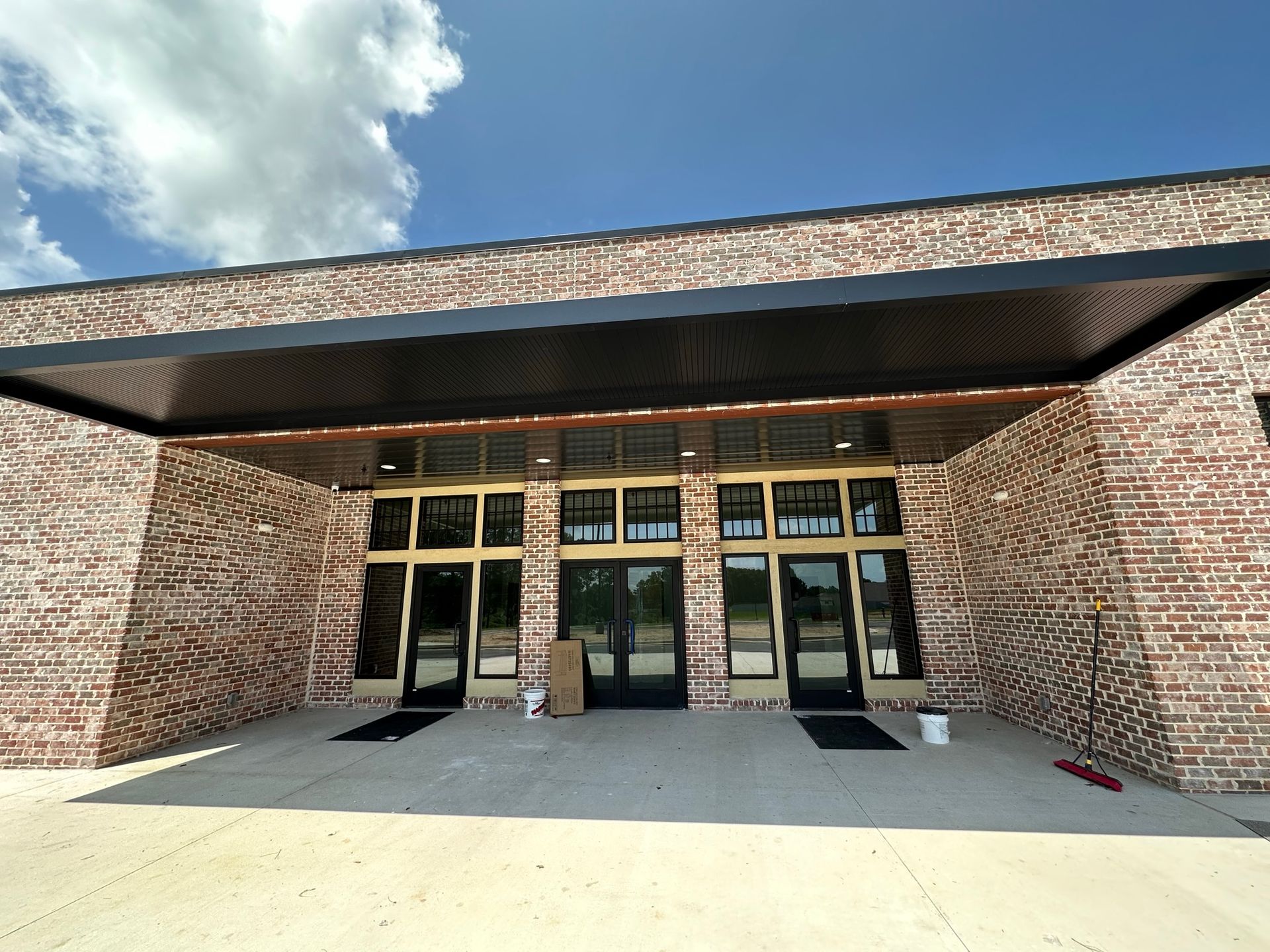 A large brick building with a canopy over the entrance