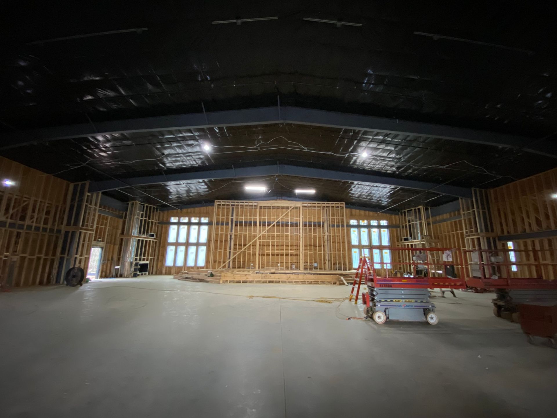 A large building under construction with a lot of windows.