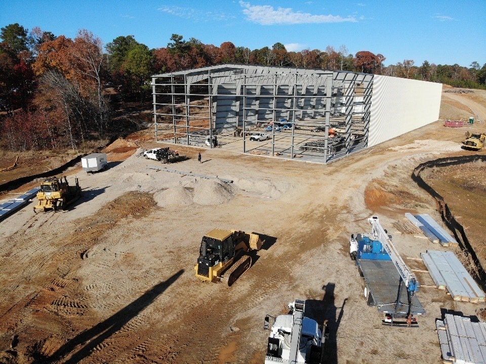 An aerial view of a large building under construction
