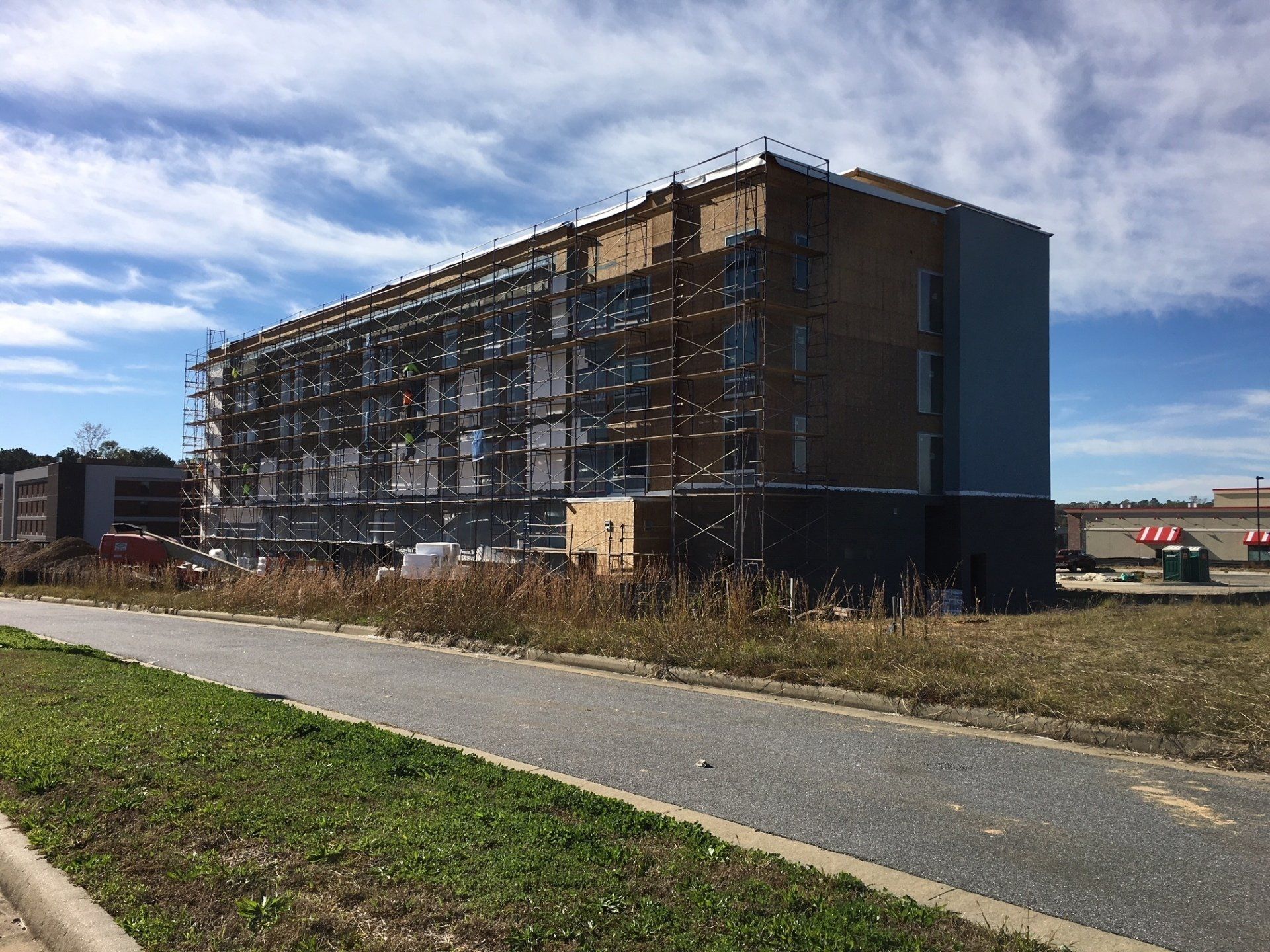 A large building is being built with scaffolding around it.