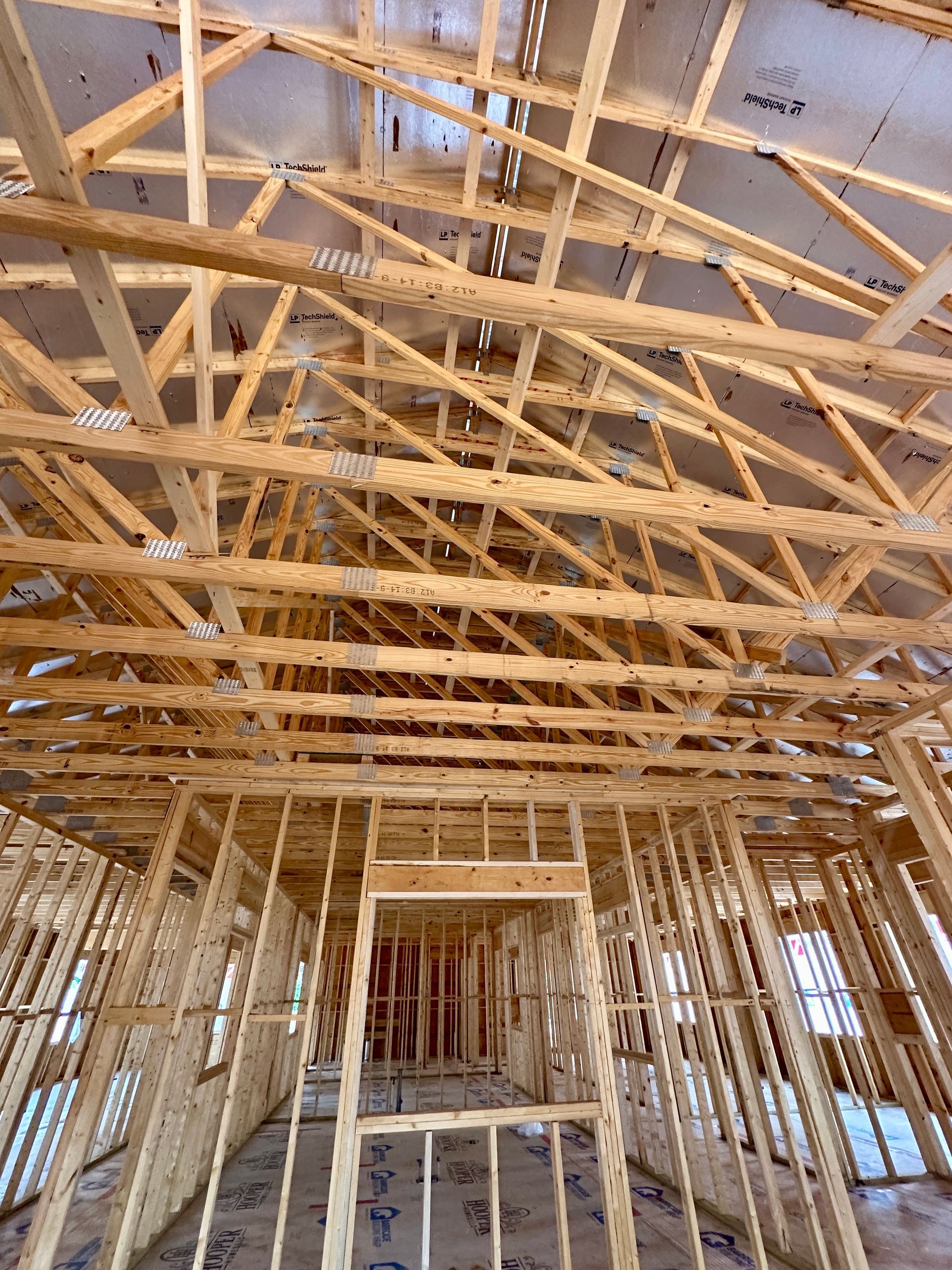 The inside of Hovey Precast under construction with a lot of wooden beams.