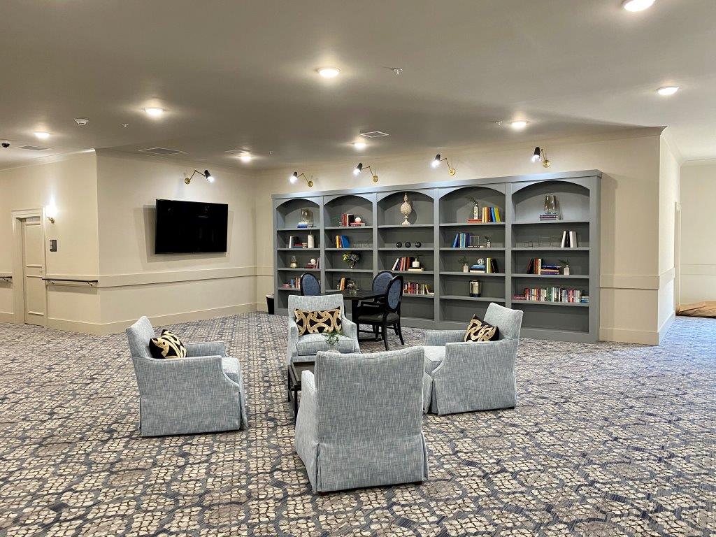 A living room filled with furniture and a television.