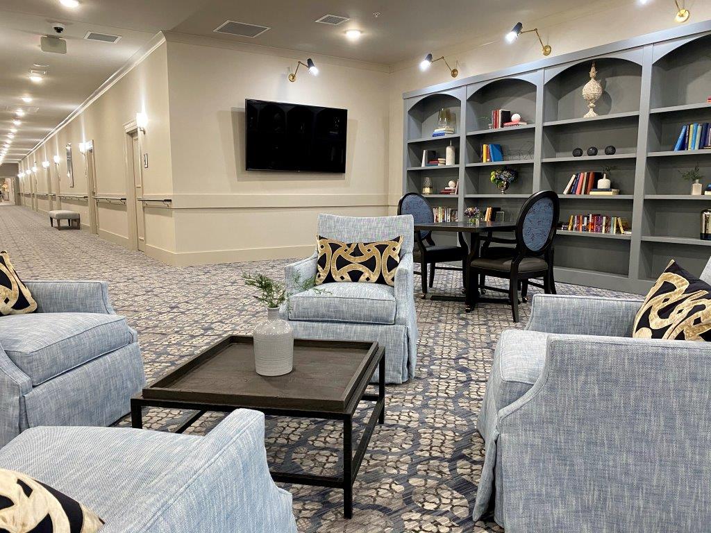 A living room filled with furniture and a television.