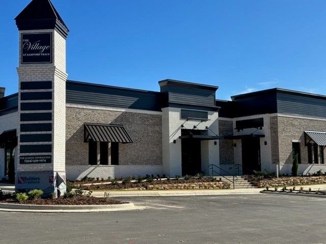 A building with a sign that says village on it