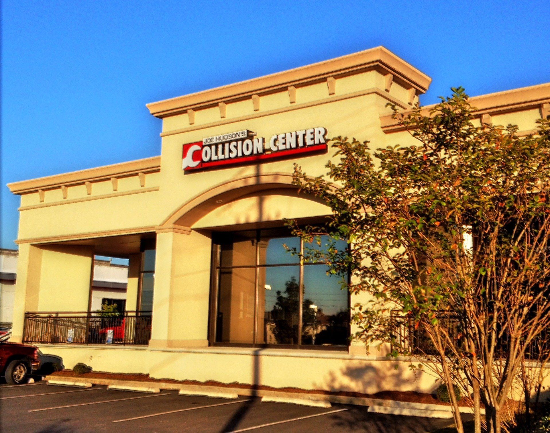 A building with a sign that says collision center