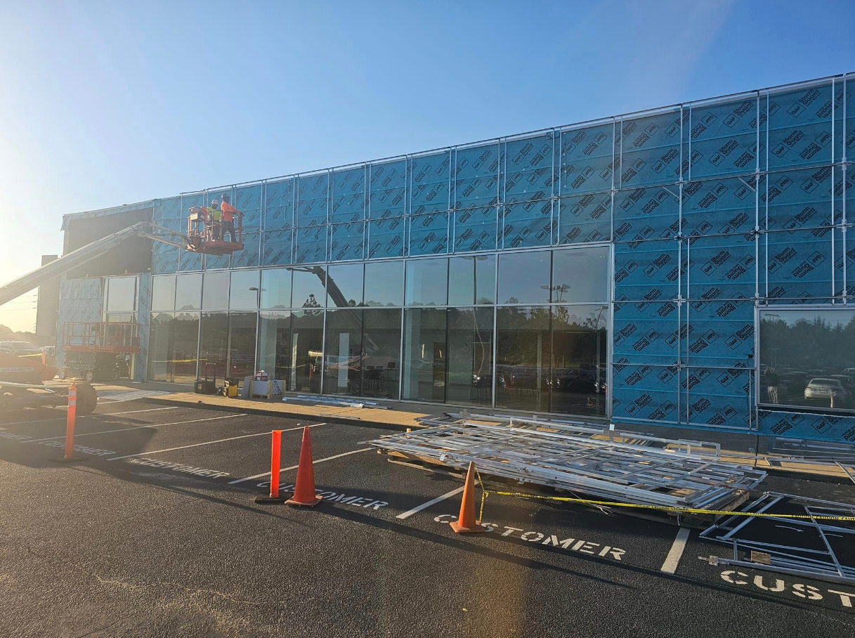 A large building with a lot of windows is being built.
