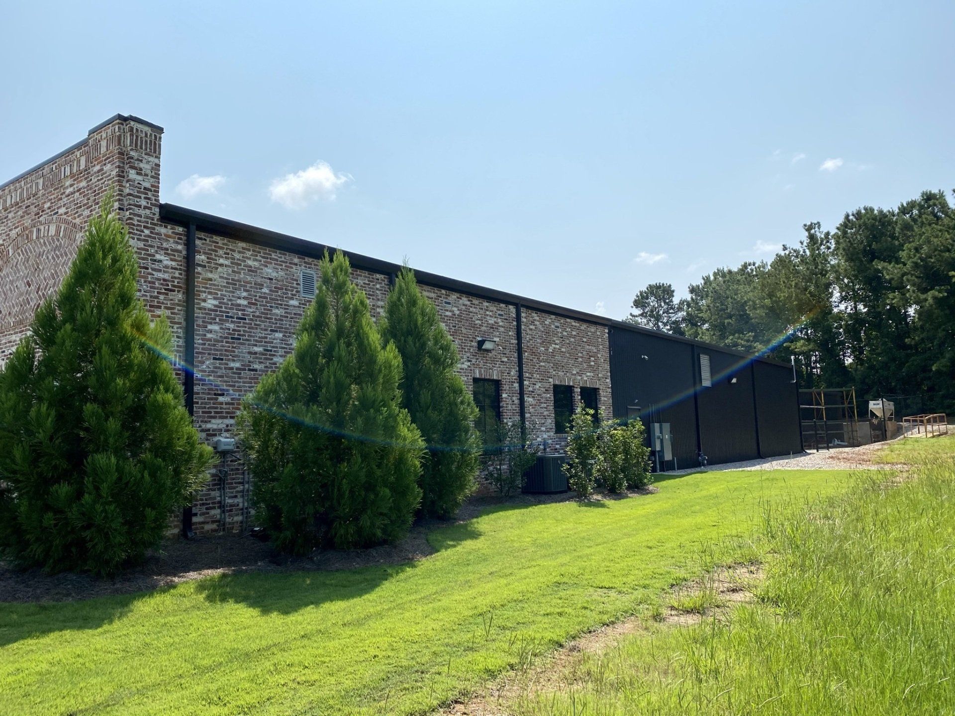 A large building with a lot of trees in front of it.