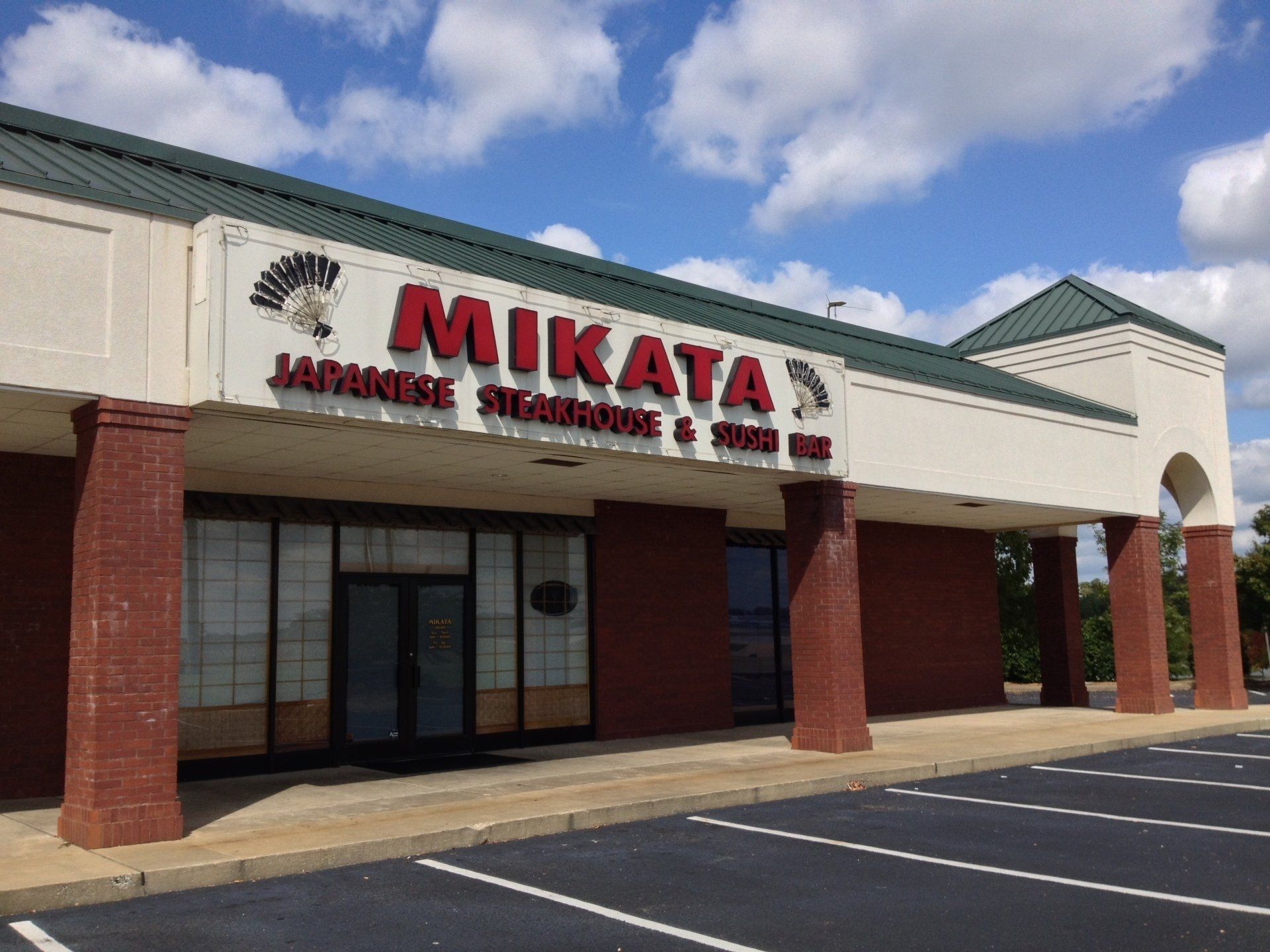 A building with a sign that says ' mikata ' on it