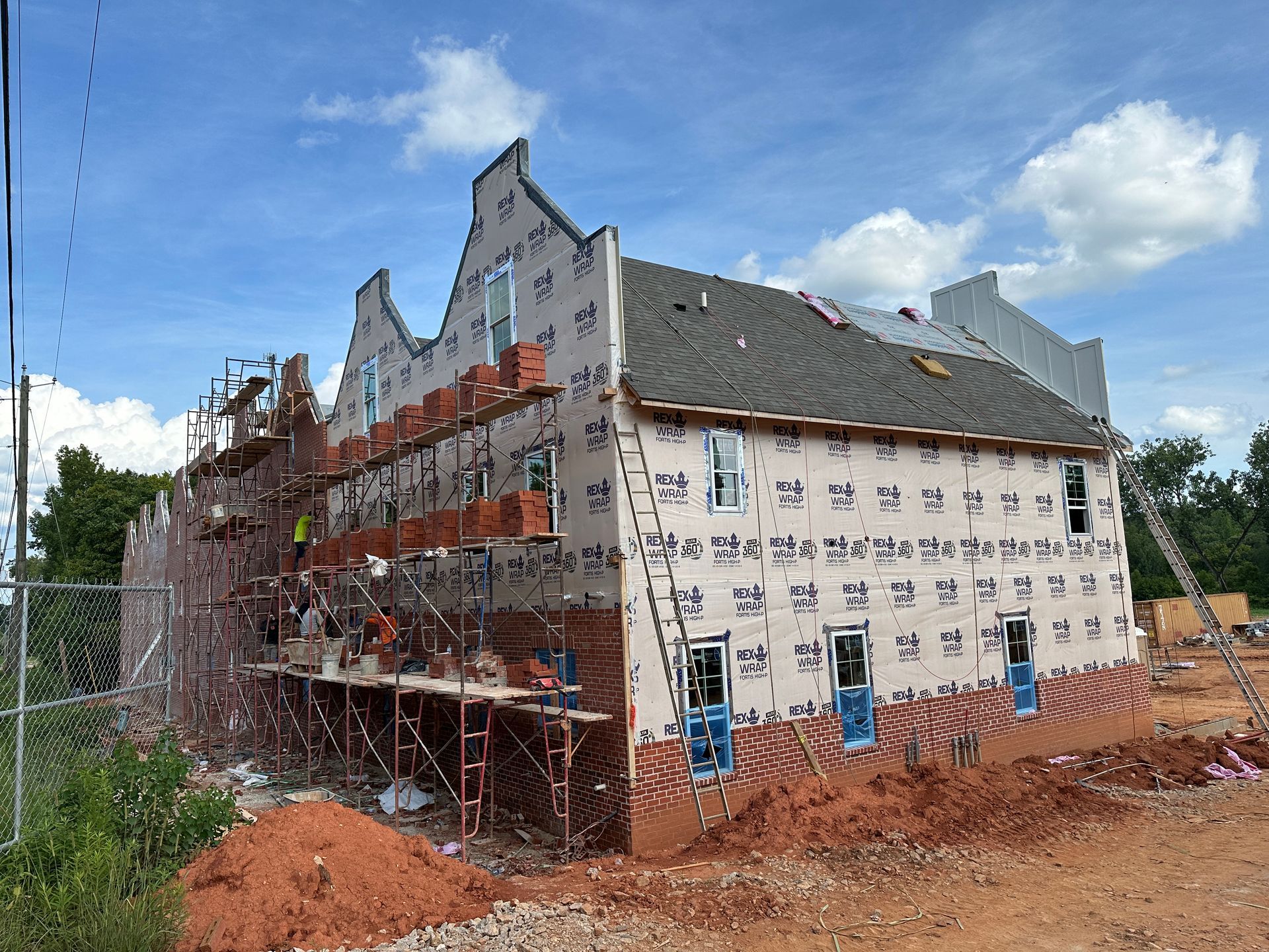 A large building is being built with scaffolding around it.