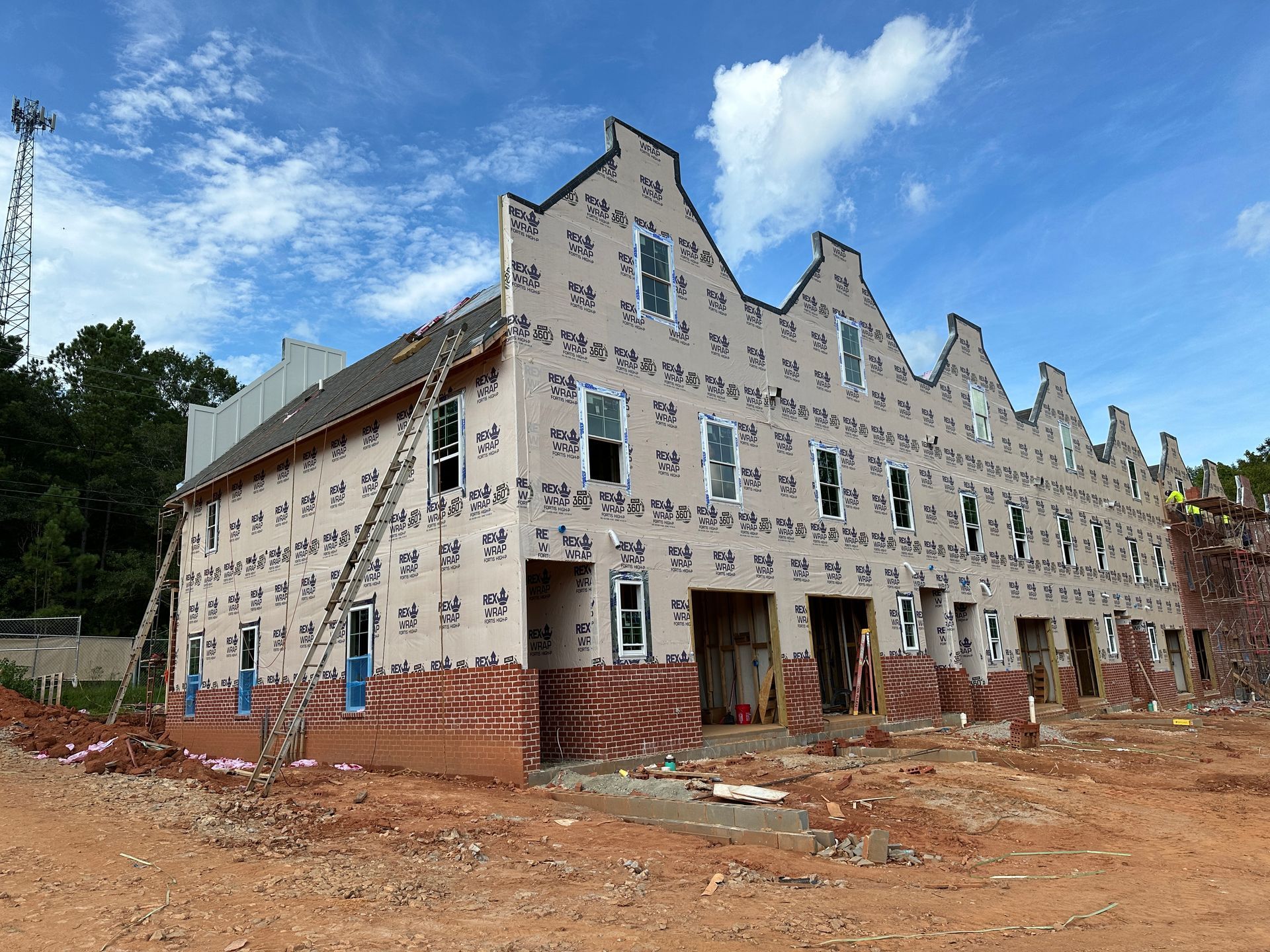 A large building with a lot of windows is being built.
