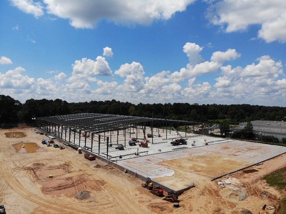 An aerial view of a large building under construction.