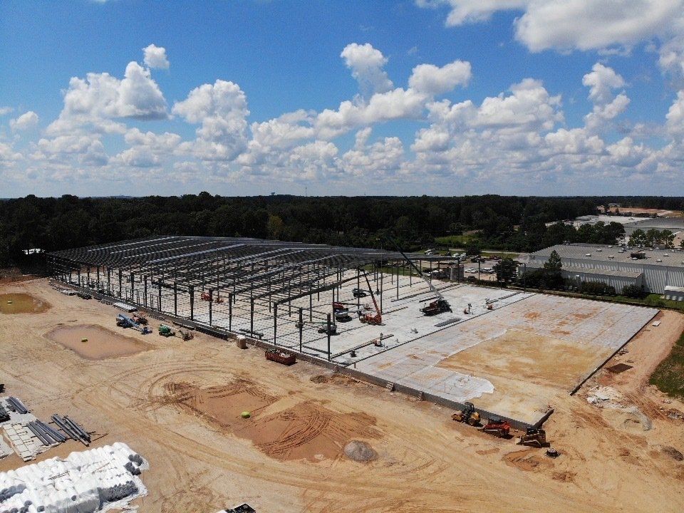 An aerial view of a large building under construction.