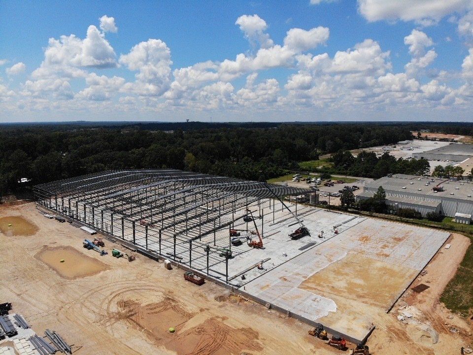 An aerial view of a large building under construction.
