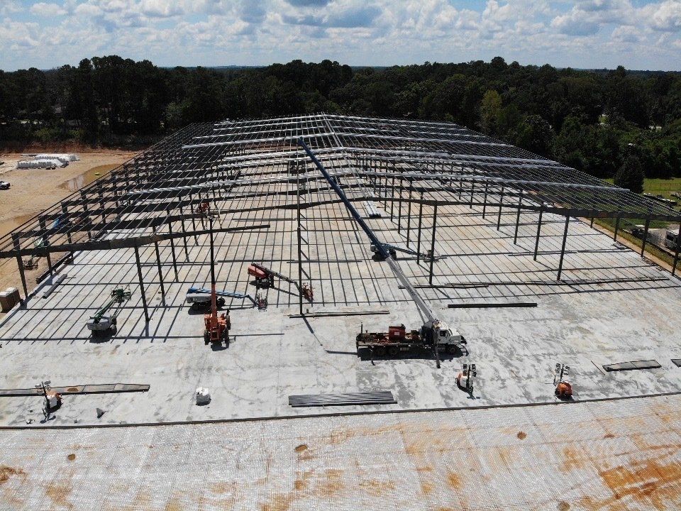 An aerial view of a large building under construction.