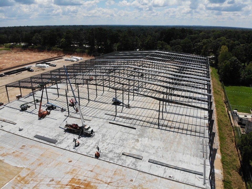 An aerial view of a large building under construction.
