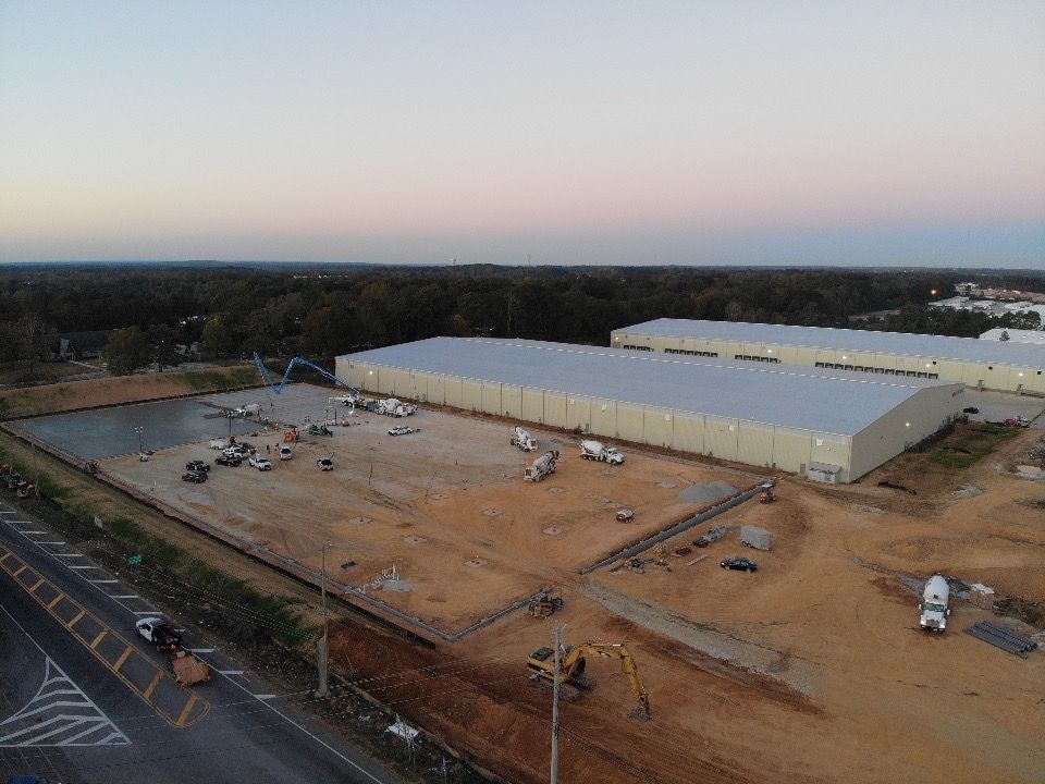 An aerial view of a large building under construction.