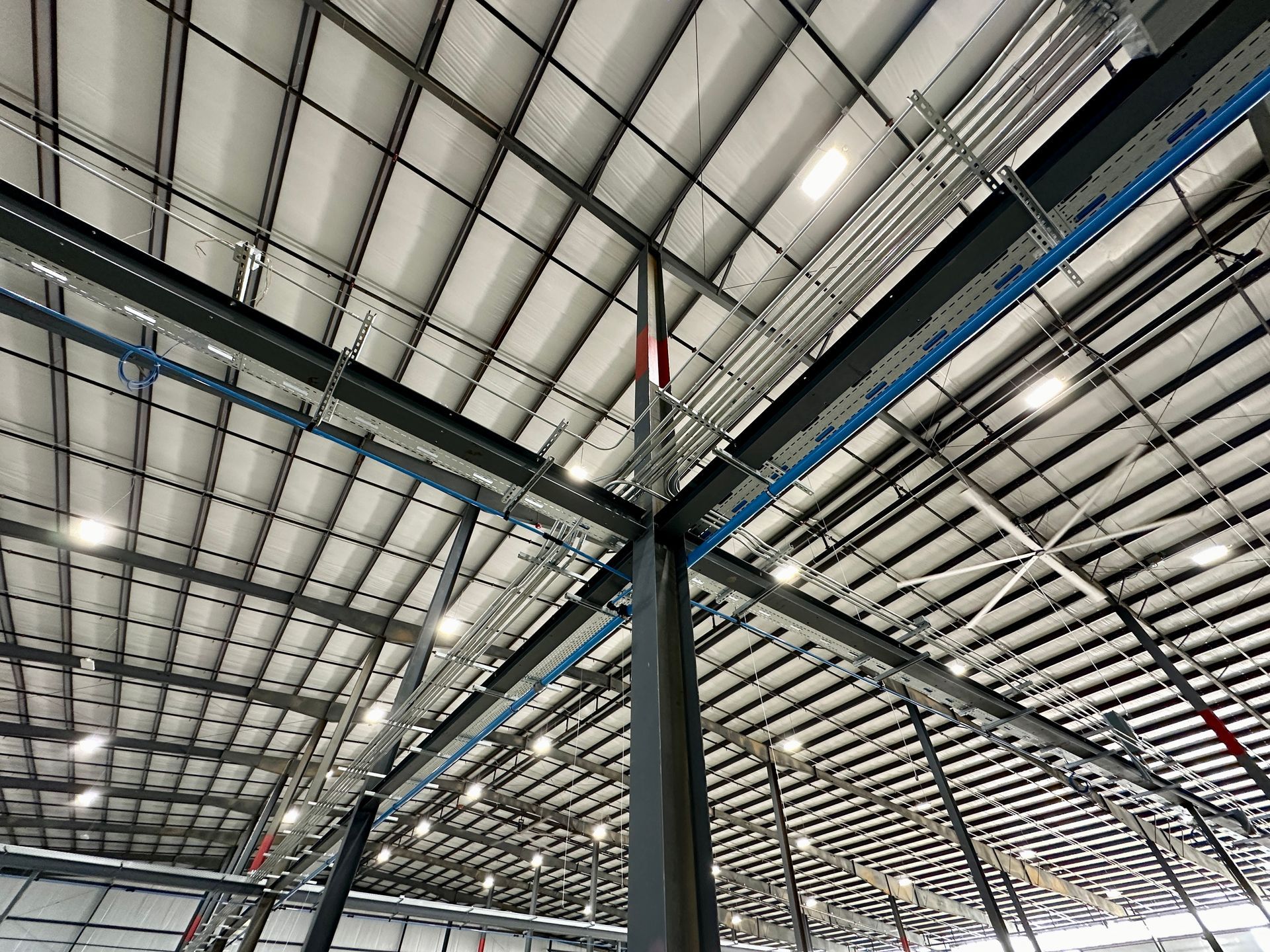 Looking up at the ceiling of a large warehouse.