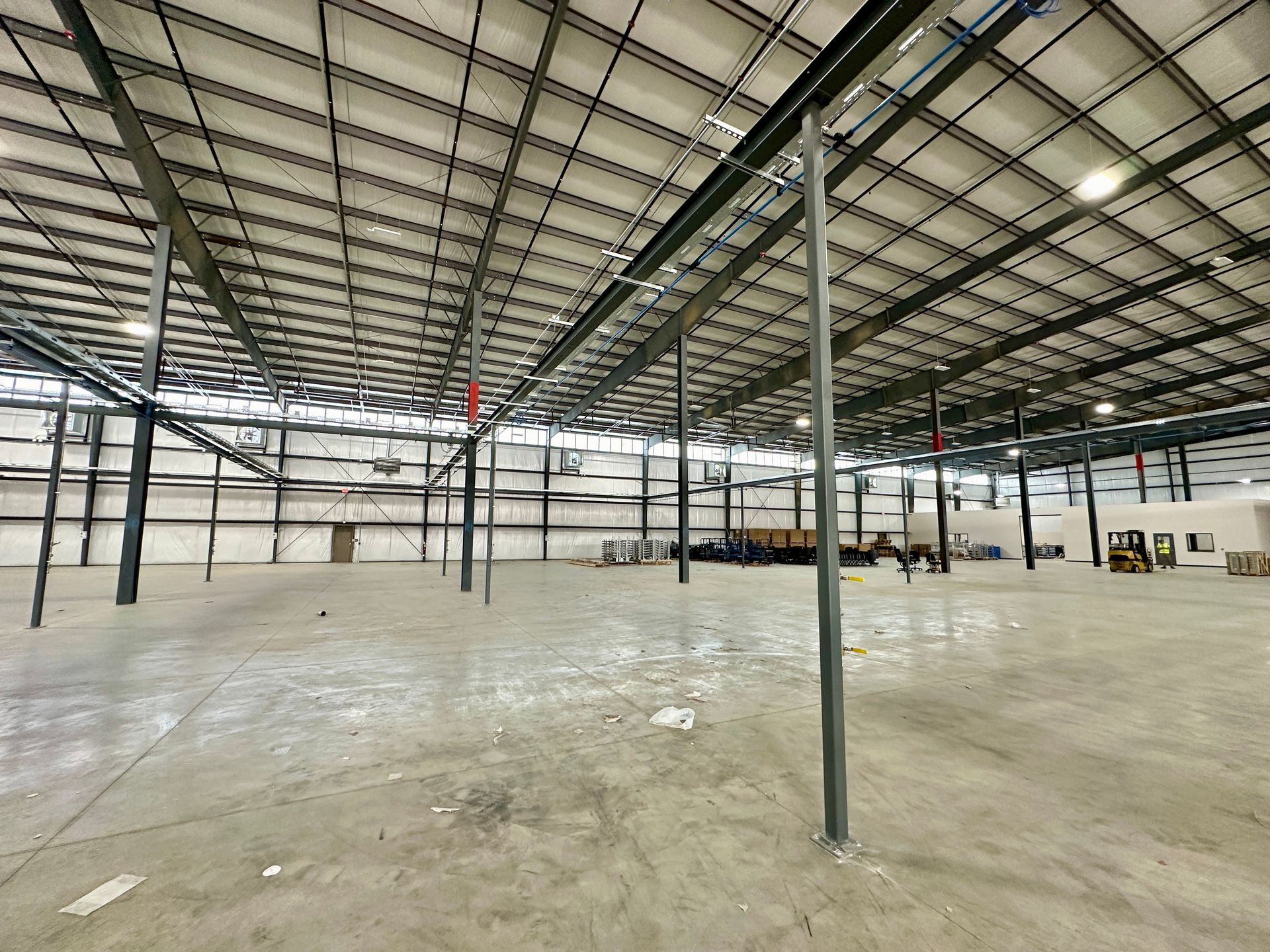 A large empty warehouse with a ceiling that is very high.