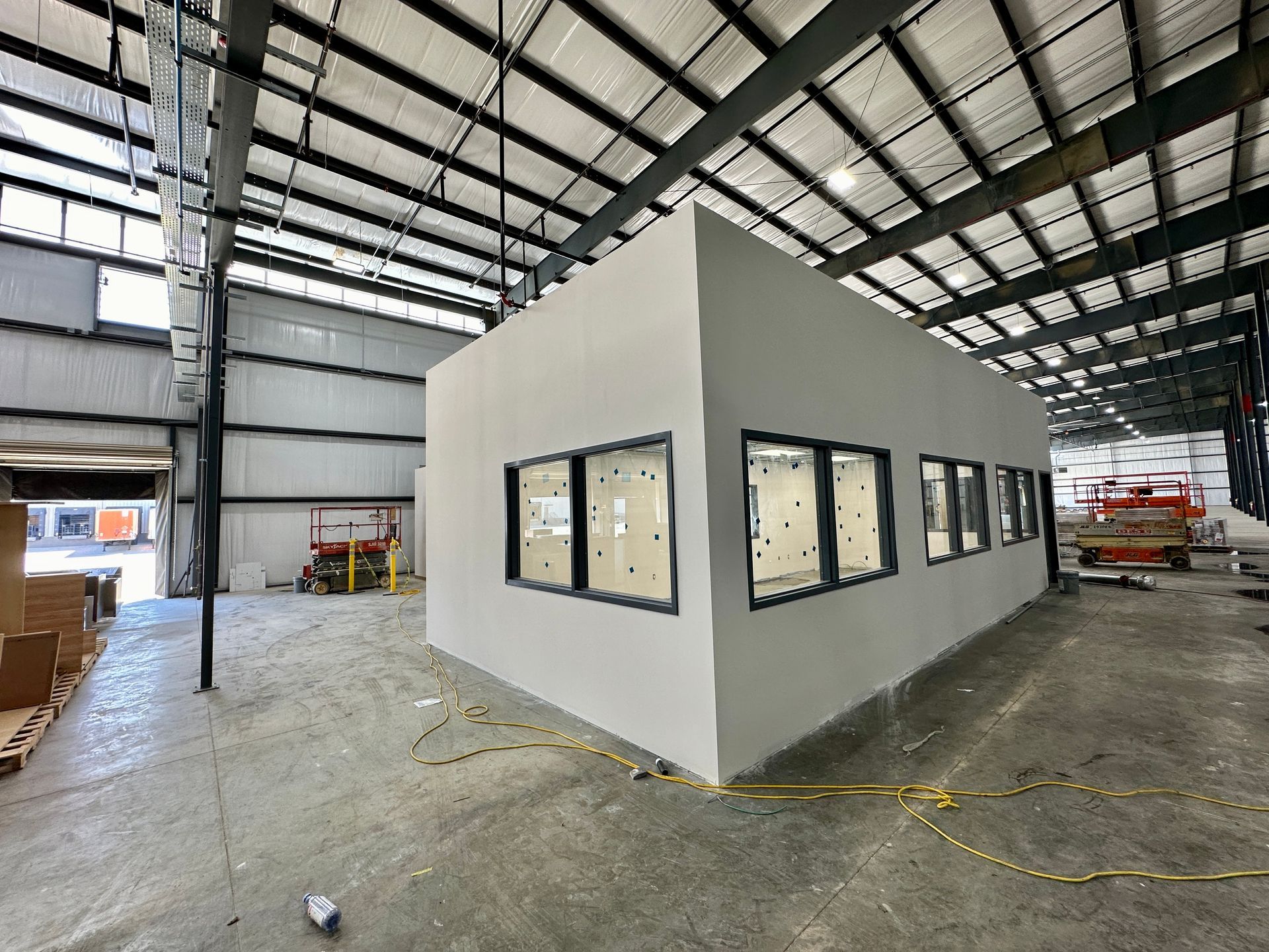 A large building with a lot of windows is being built.