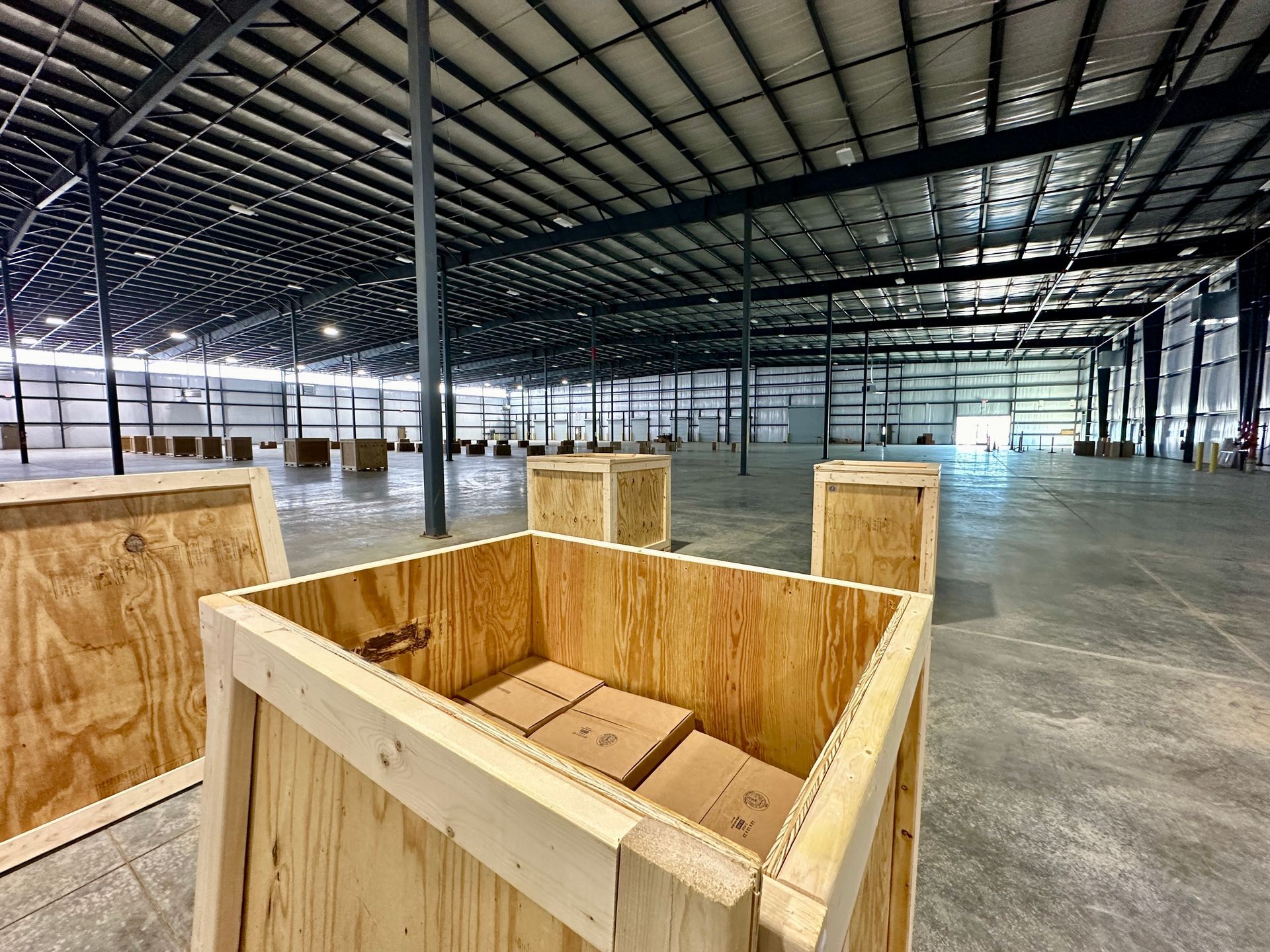 A warehouse filled with wooden crates and boxes.