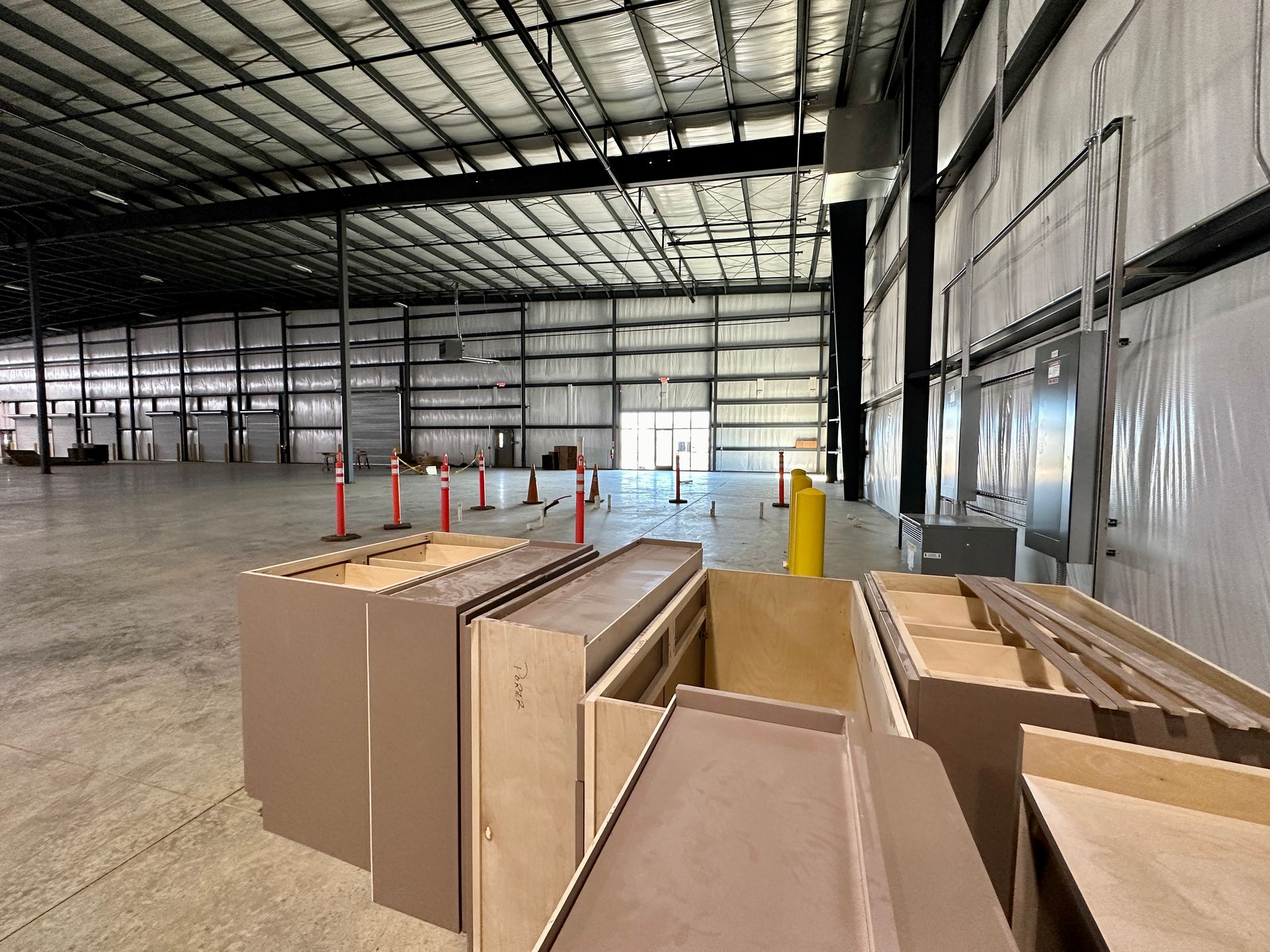 A large warehouse filled with lots of wooden boxes.