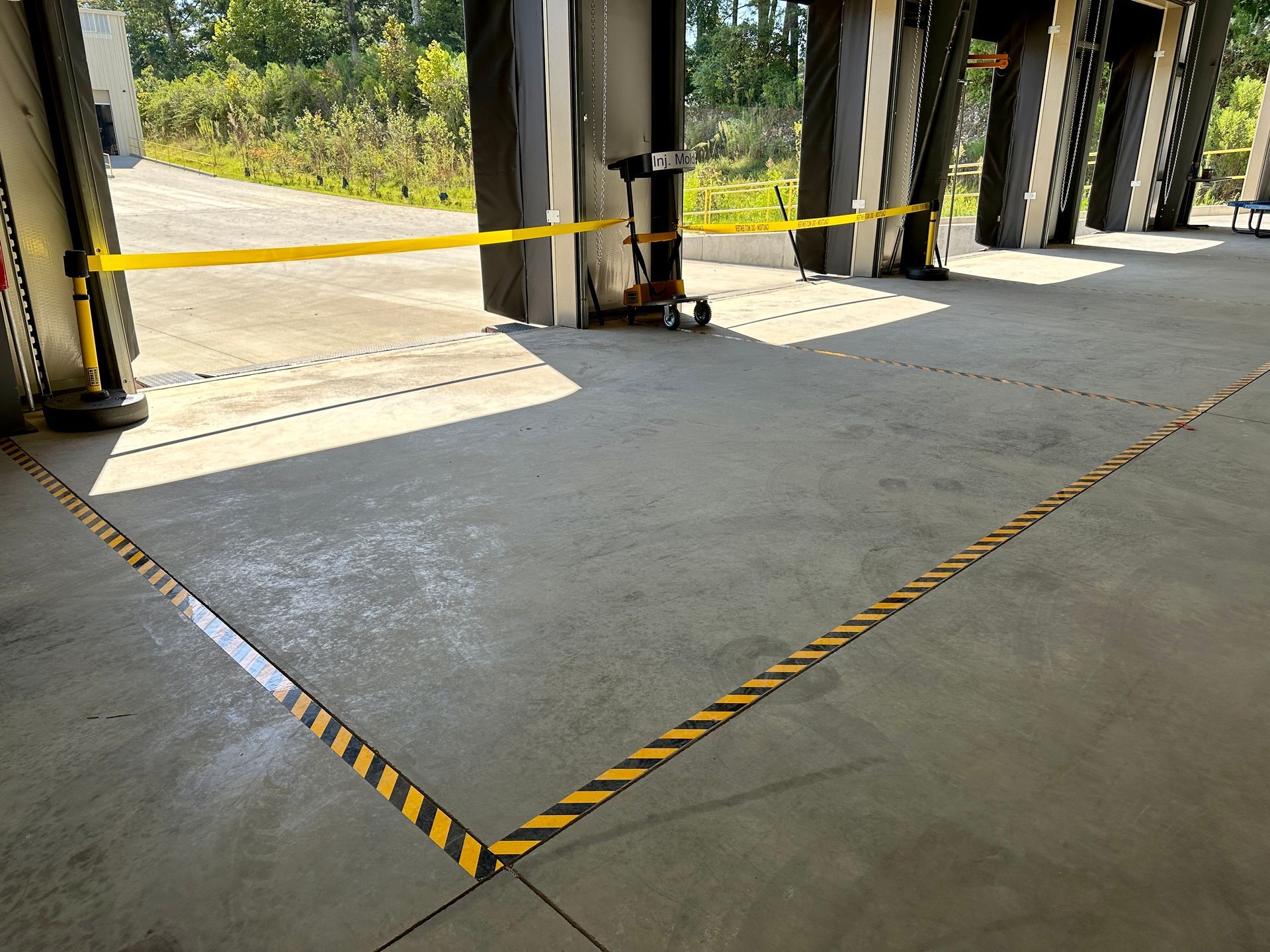 A warehouse with a yellow tape on the floor