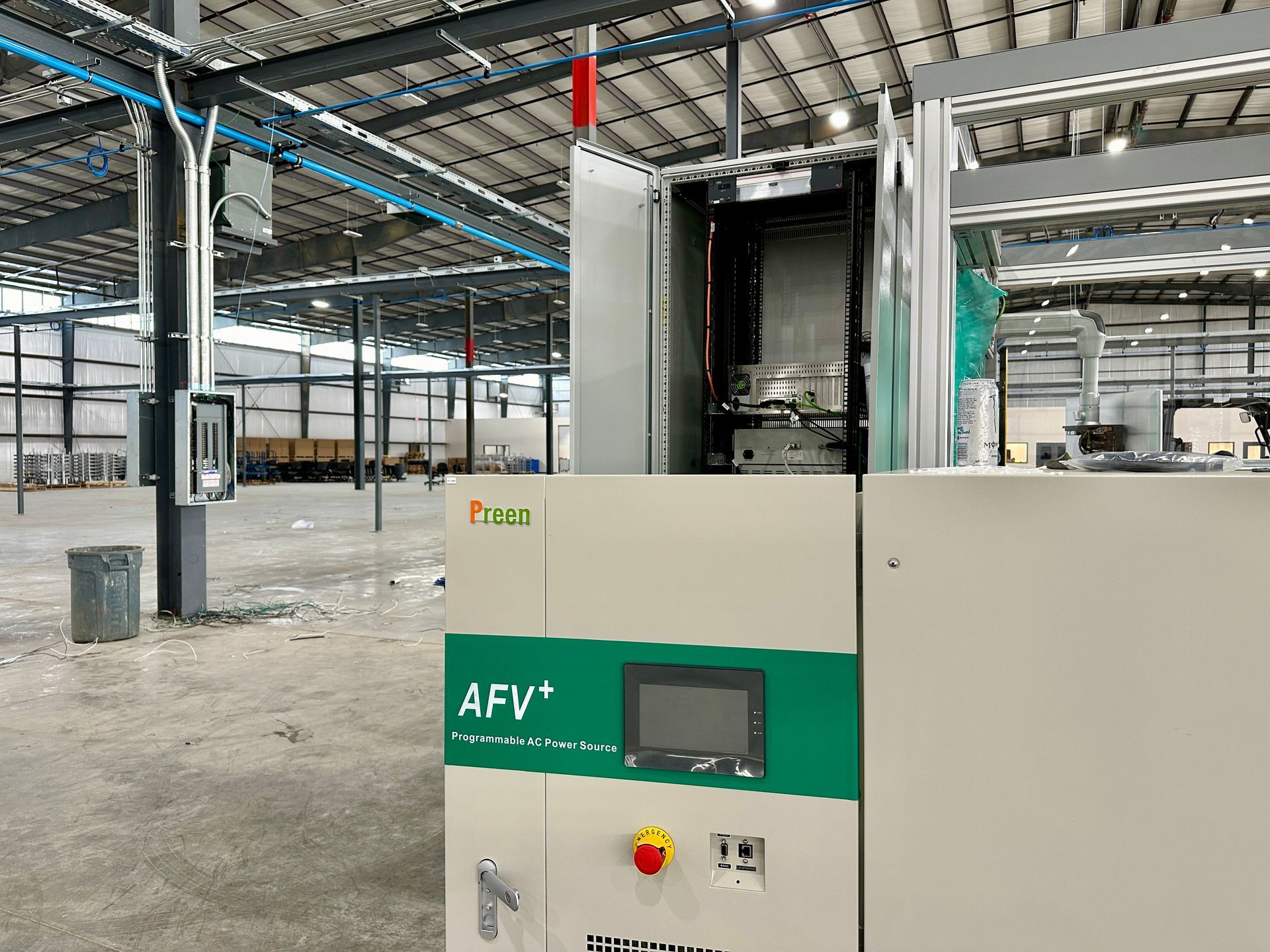 A warehouse with a machine that says afv on it