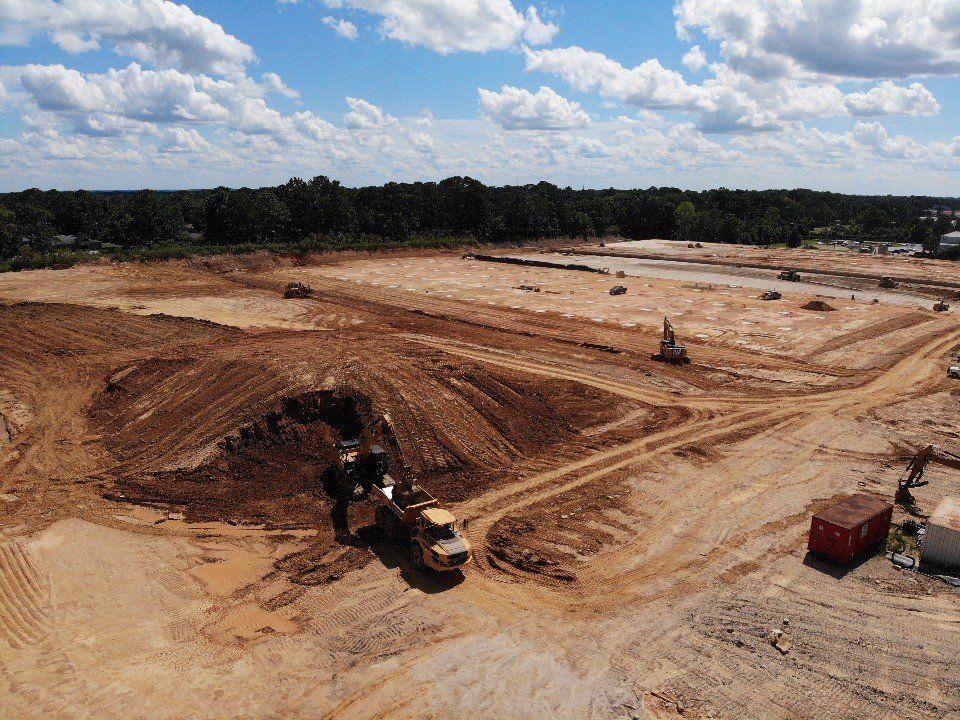 An aerial view of a construction site with a lot of dirt.