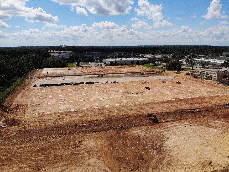 An aerial view of a large construction site in the middle of a city.