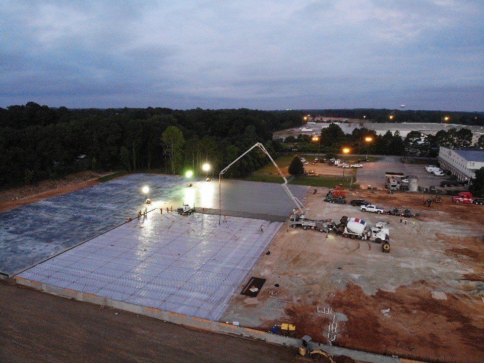 An aerial view of a construction site at night.