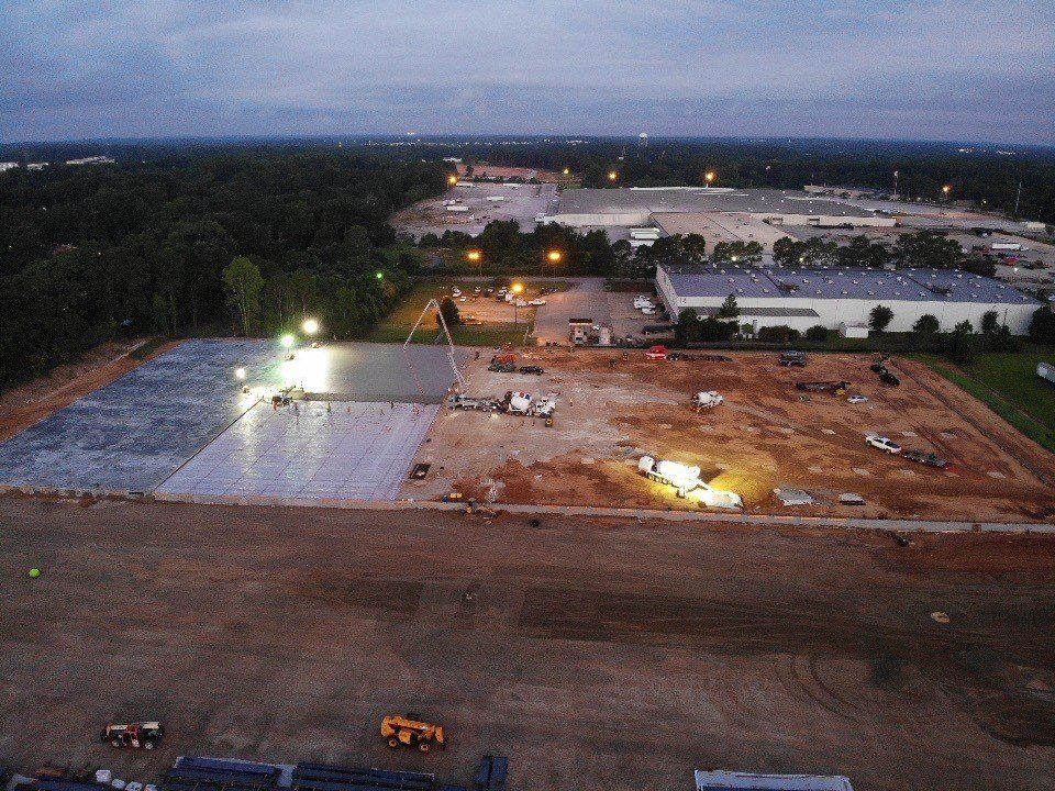 An aerial view of a construction site at night.