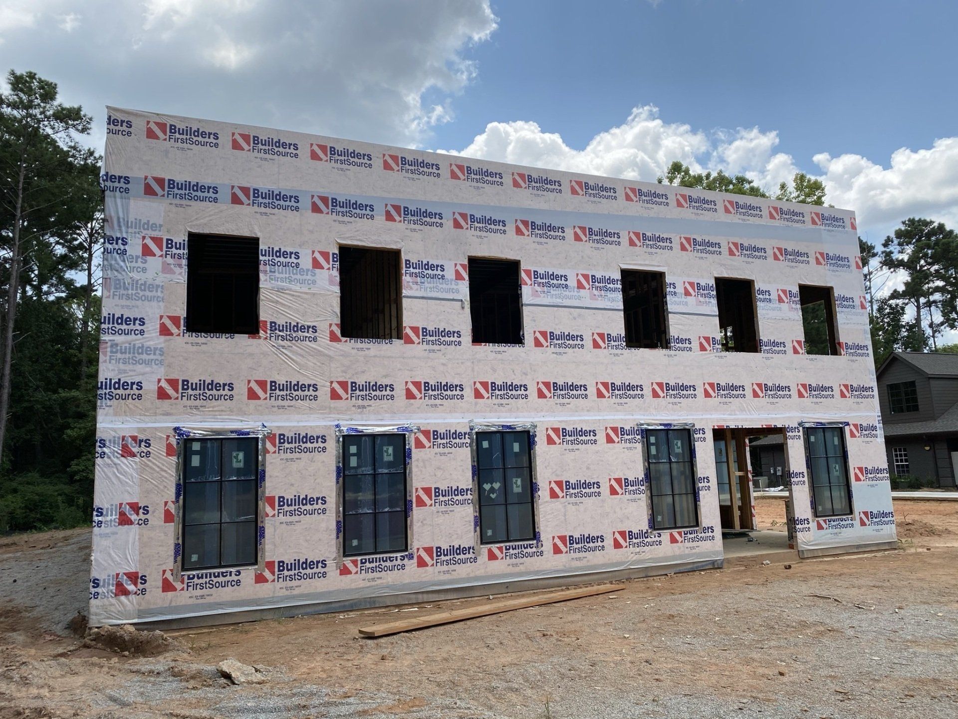 A large building with a lot of windows is being built.