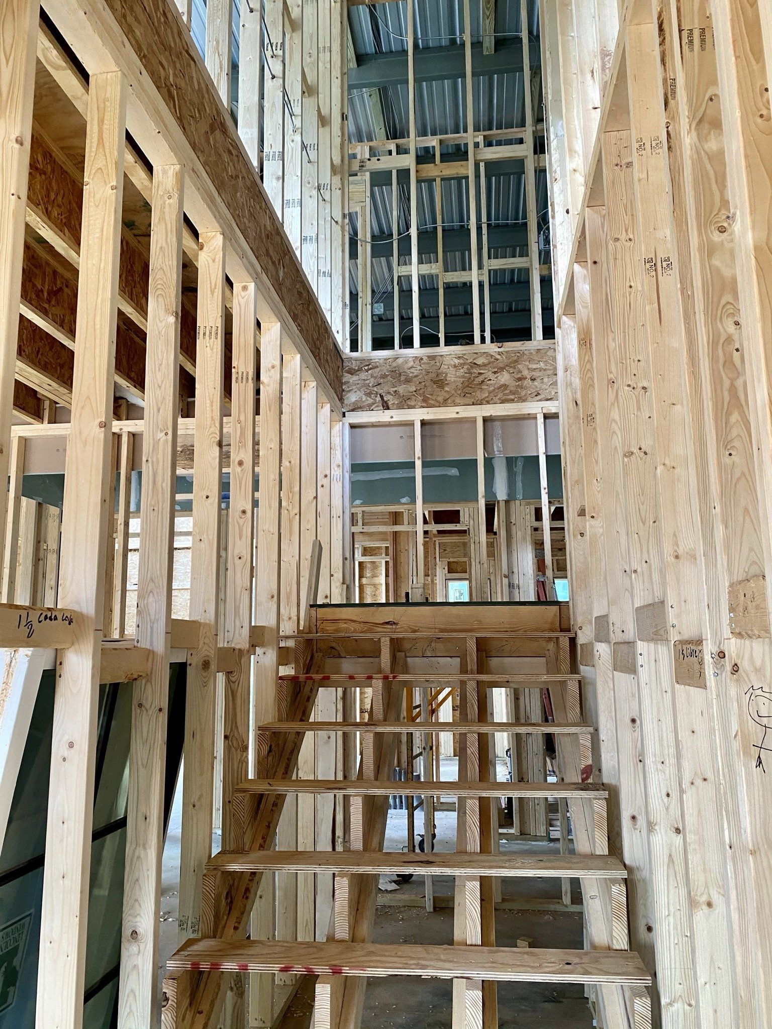 A wooden staircase in a building under construction