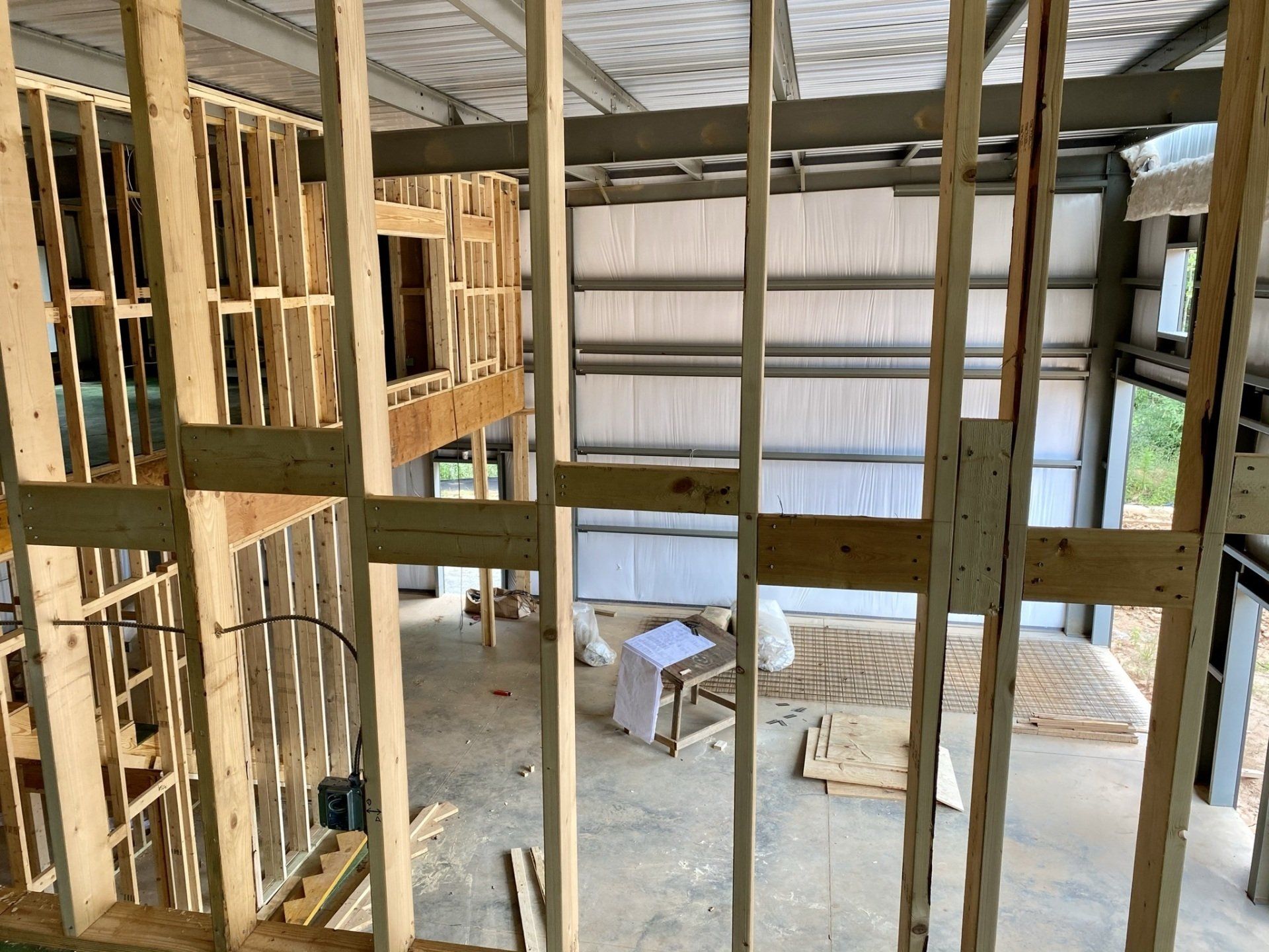 A building under construction with a lot of wooden beams.