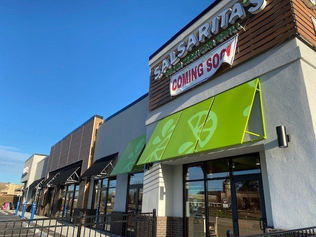Salsarita 's restaurant is coming soon with a green awning