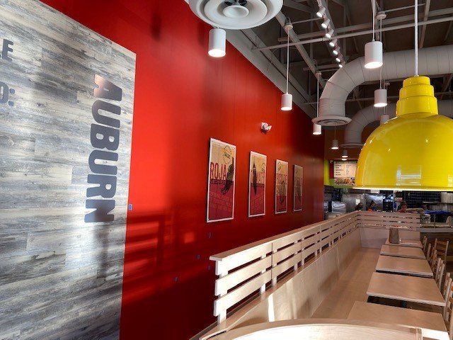 A restaurant with a sign on the wall that says auburn