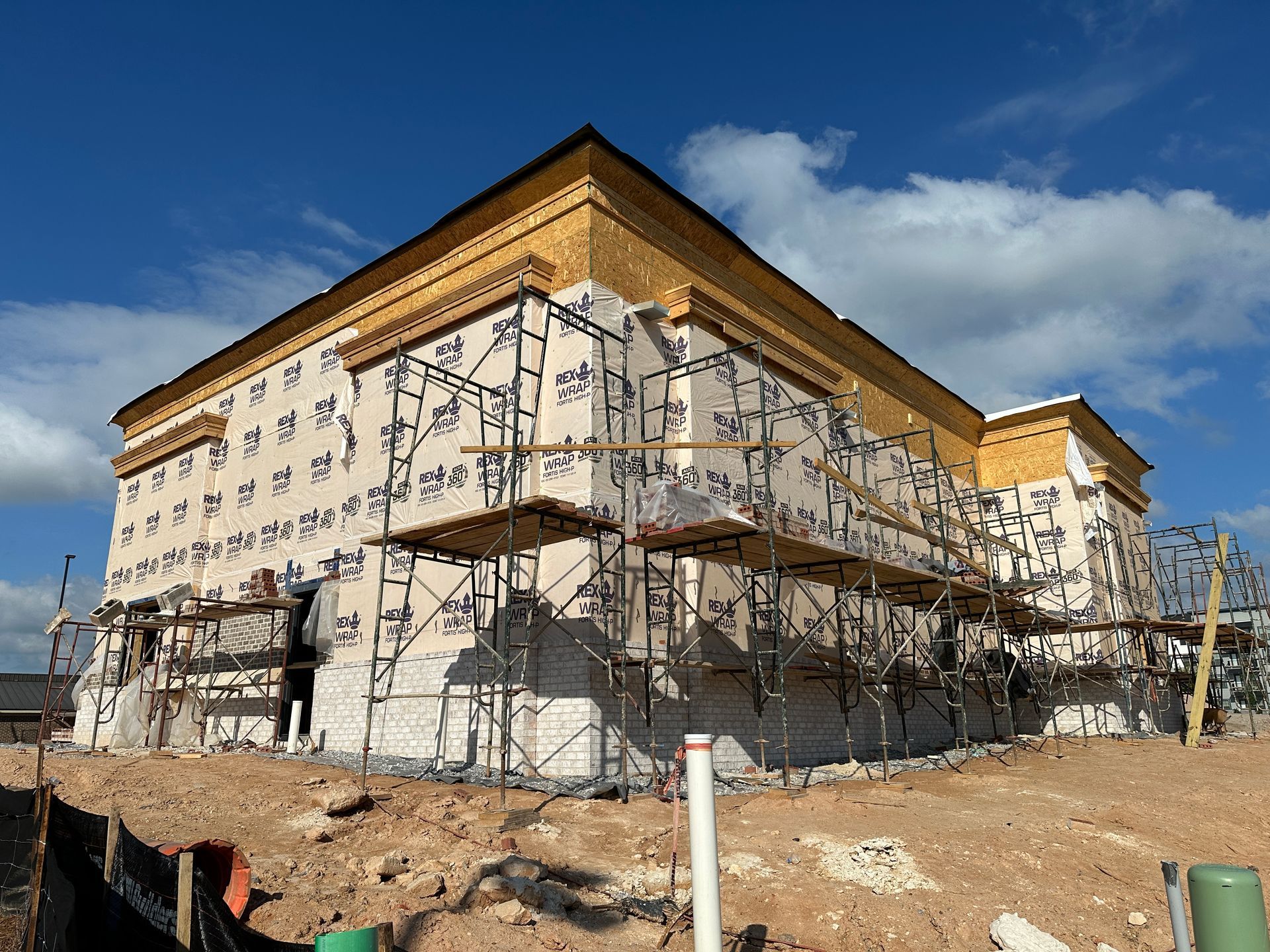 A large building is being built with scaffolding around it.