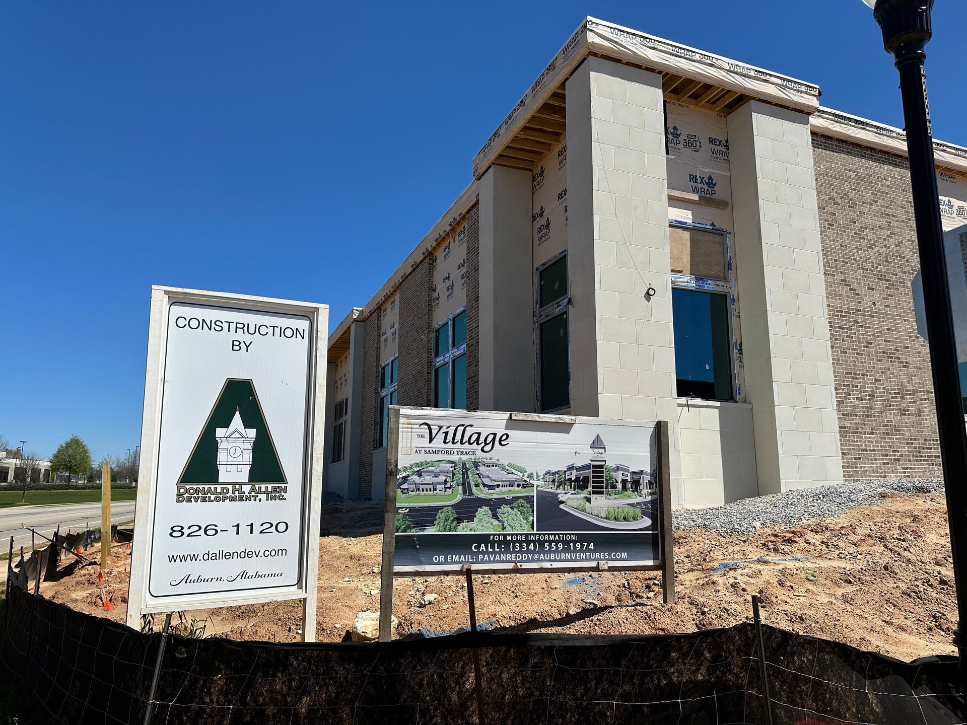 A building under construction with a sign that says village